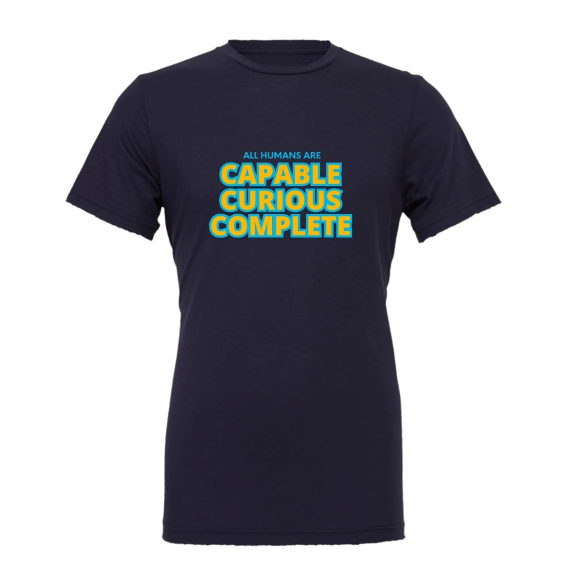 Product Description: All Humans are Capable shirts made by our Adult Services Program students!</br></br>Airlumecombed and ring-spun cotton/ polyester</br>Pre-shrunk</br>Retail fit</br>Unisex sizing - Prices may vary due to material costs</br>Cover Stitched collar and sleeves</br>Shoulder-to-shoulder taping</br>Side seams</br>Tear away label</br> All Humans Are Capable T-Shirt